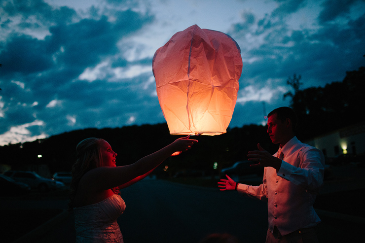 lighting lanterns at a wedding